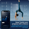 Person in a handstand with fitness tracking app on phone and graphs